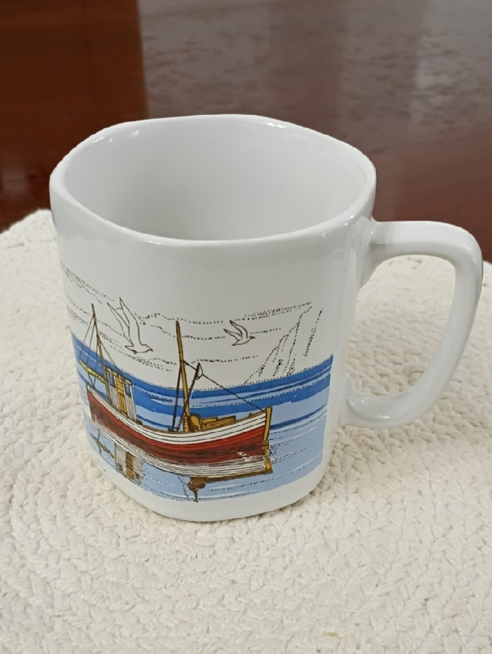 White Ceramic Coastal Boat Mug with Blue and Red Accents